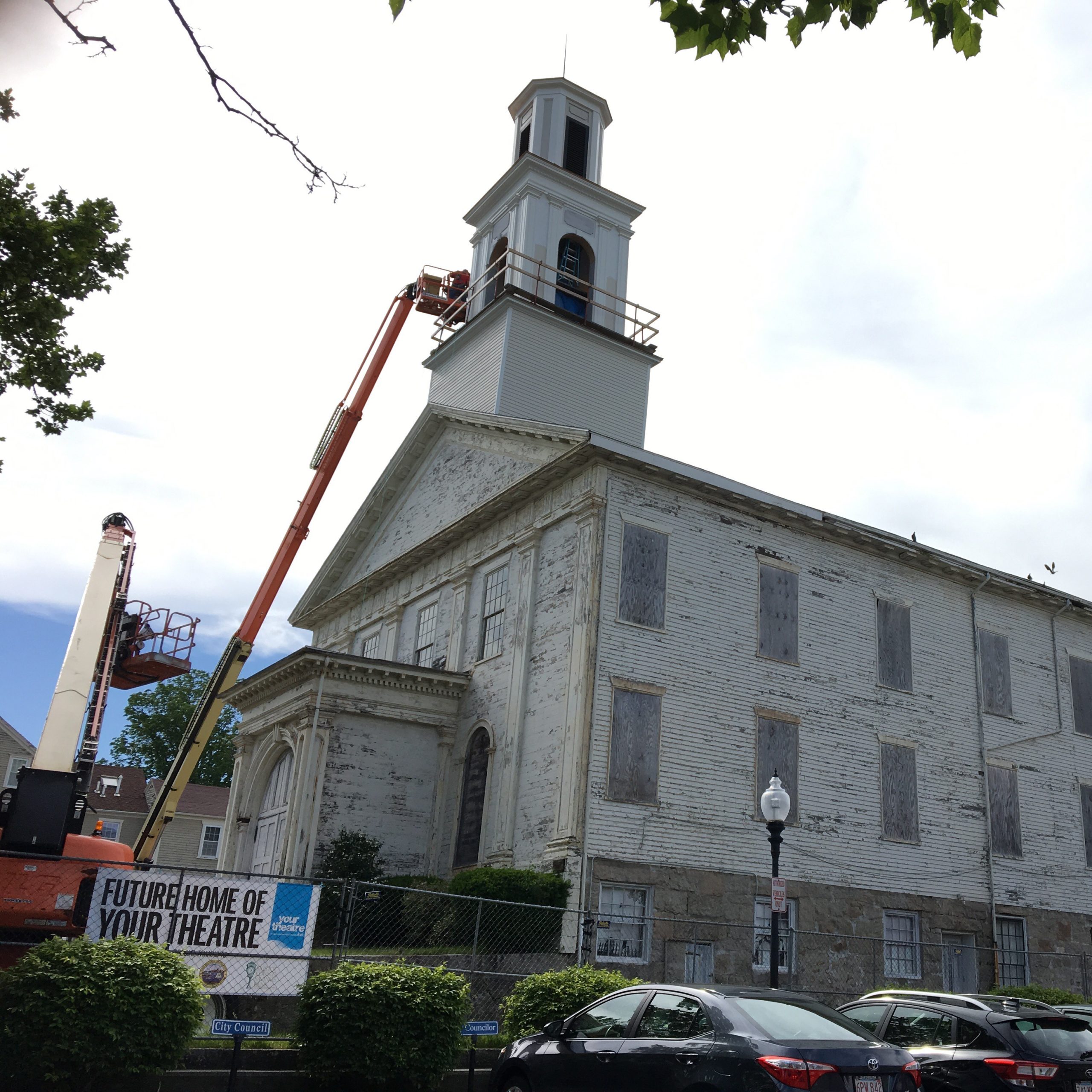 CPA-interior-work-FBC-3-1wmaller Steeple Playhouse during renovations with a freshly rebuilt steeple, very deteriorated paint, and a sign that says "future home of your theatre"